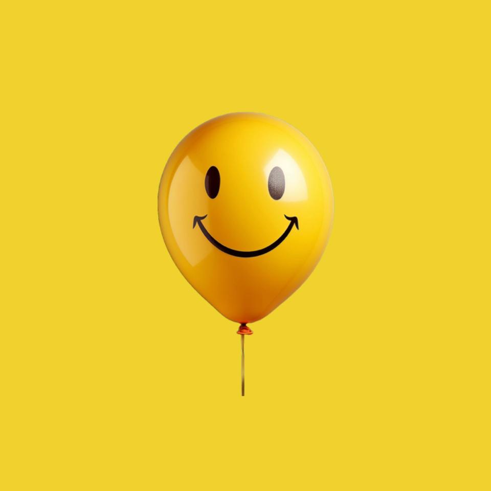 Yellow balloon with happy face